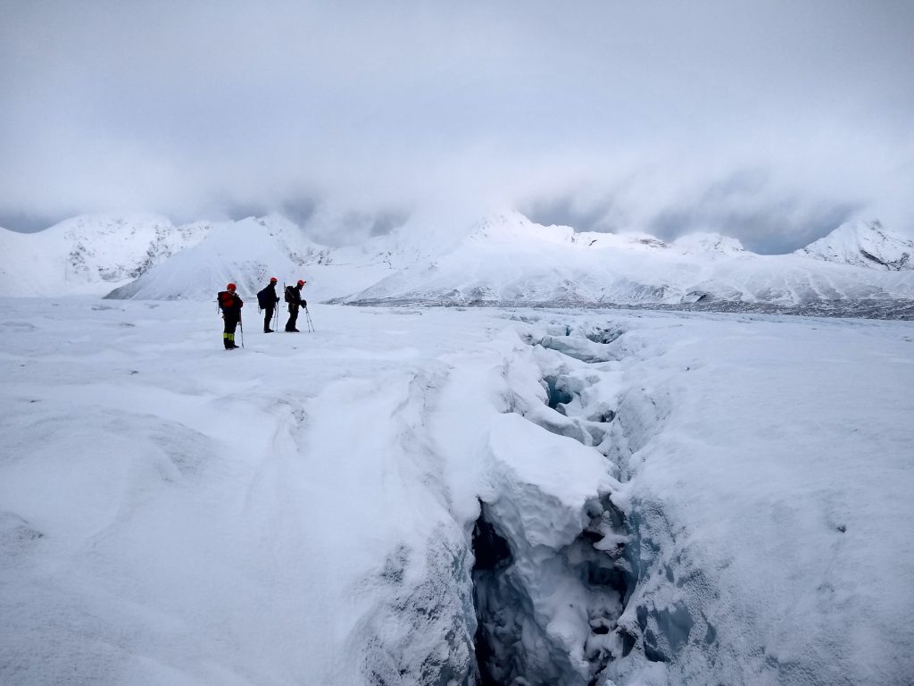 Must-See Attractions in Norway -- 2 person walking on snow covered ground during daytime